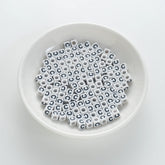 BD00114-01-black-letter-white-opaque-cube-alphabet-beads-single-c-7mm